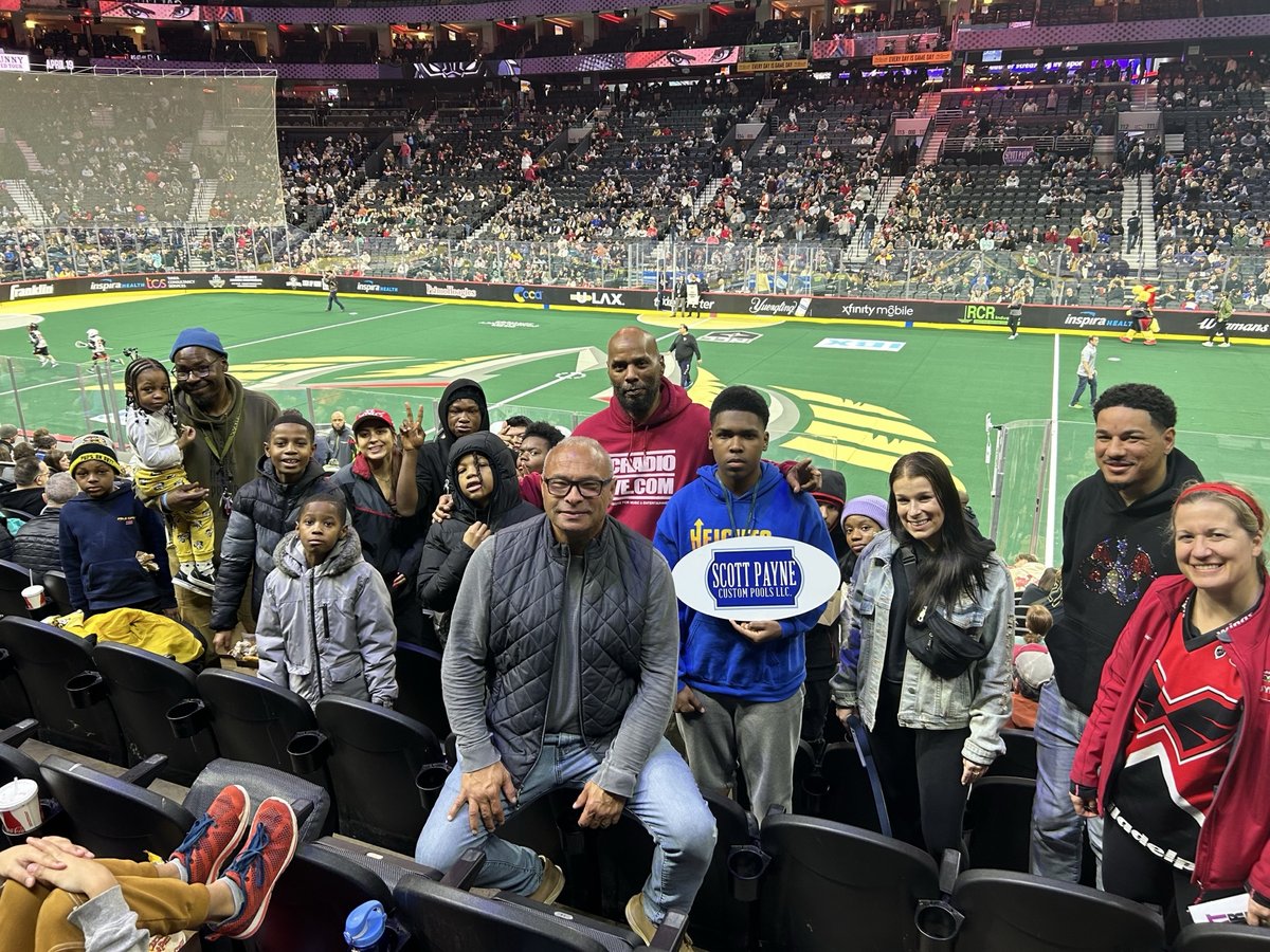 Scott Payne Custom Pools at lacrosse game with SPCP sign