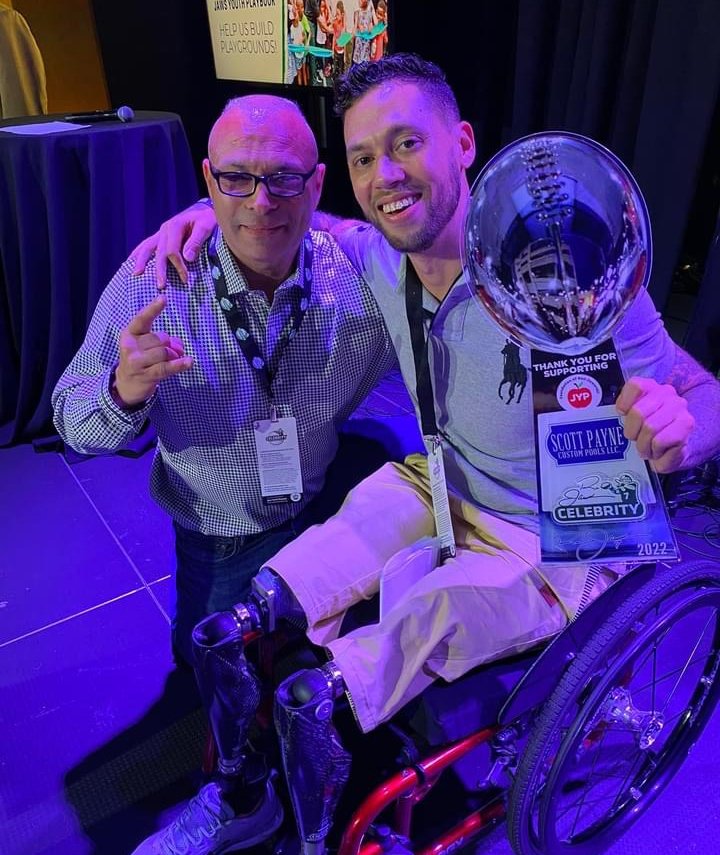 Scott Payne with wounded veteran at Celebrity Golf 2022