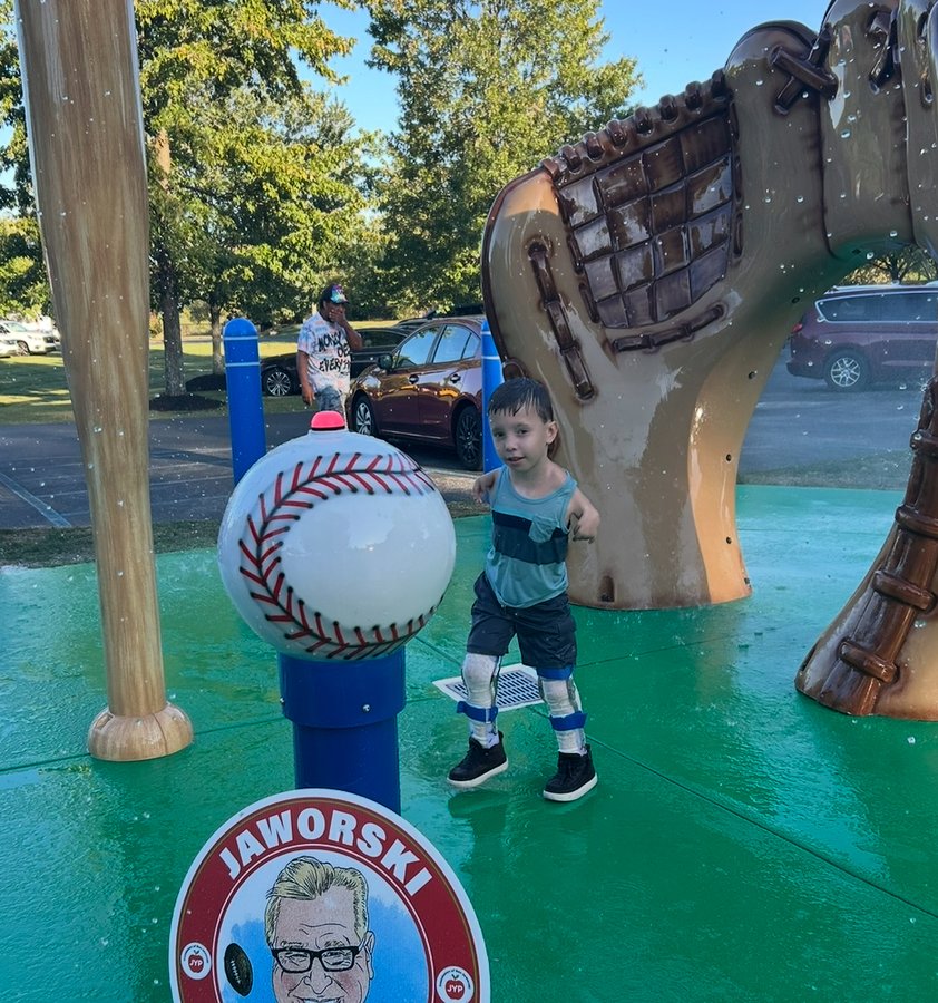 Child playing on the Miracle League splash pad