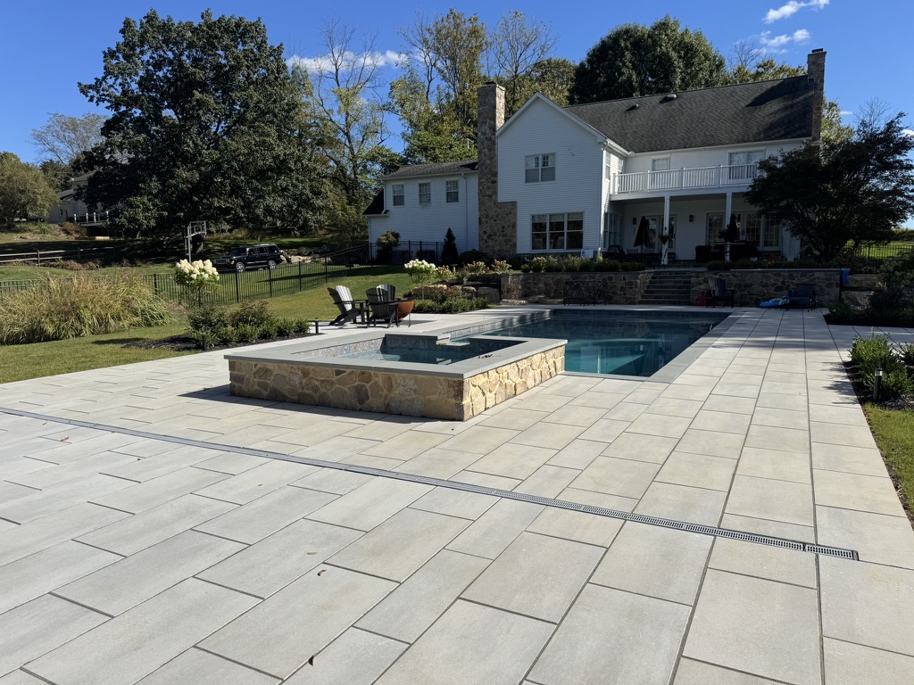 Resort-style pool with grotto waterfall and slide in Bethlehem PA