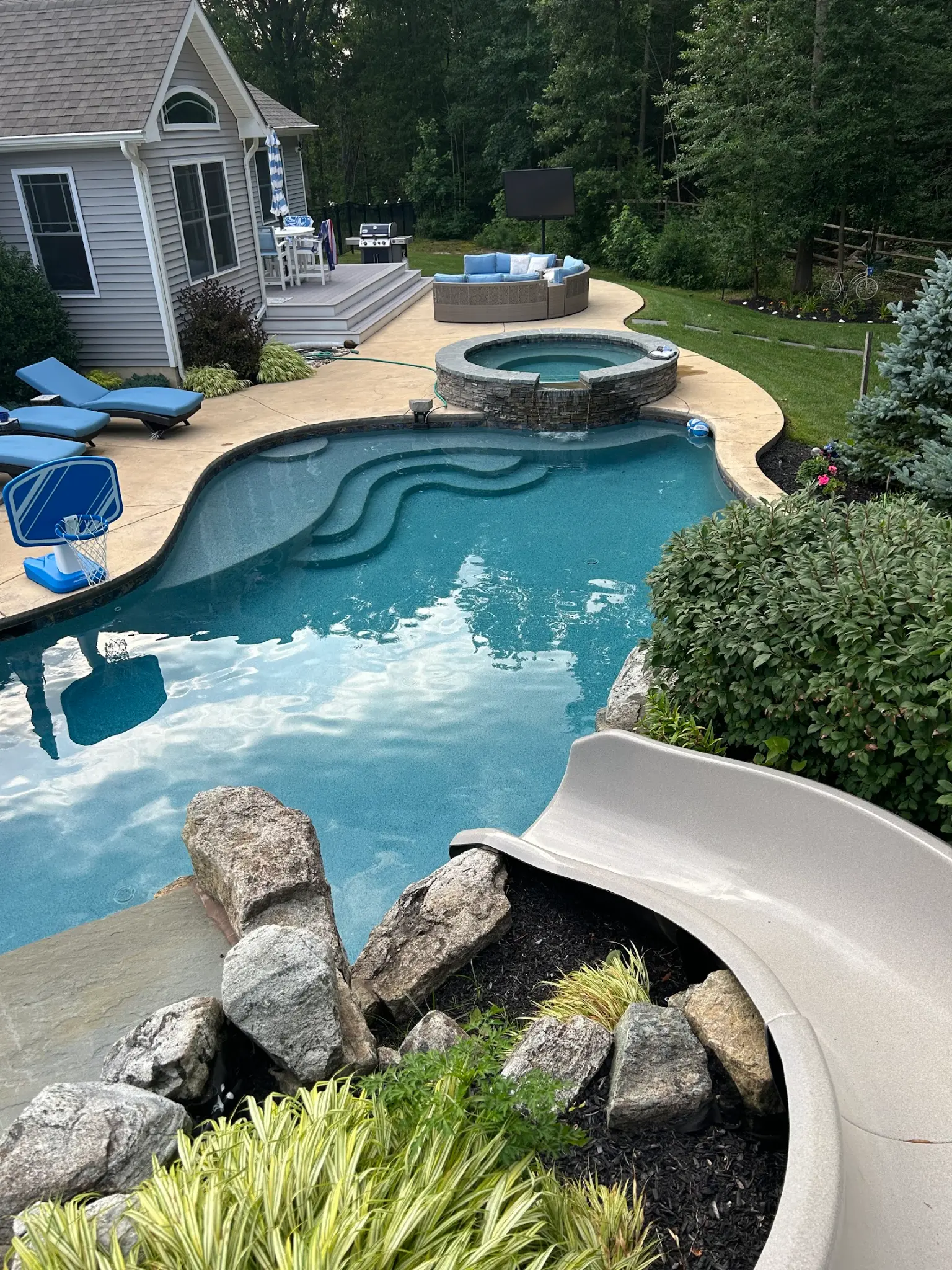 Joe J.'s pool — aerial view with slide
