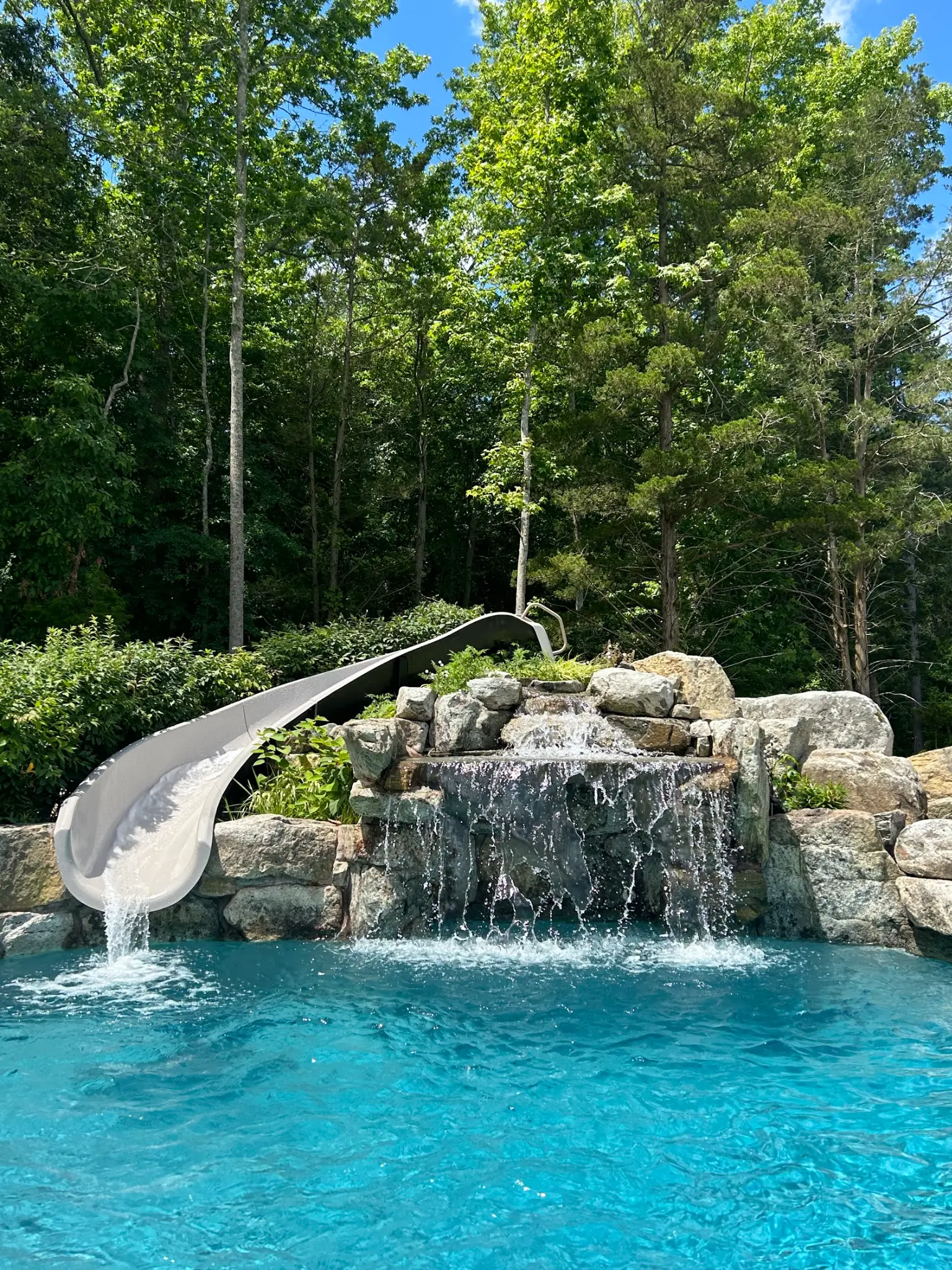 Joe J.'s pool — waterfall and slide