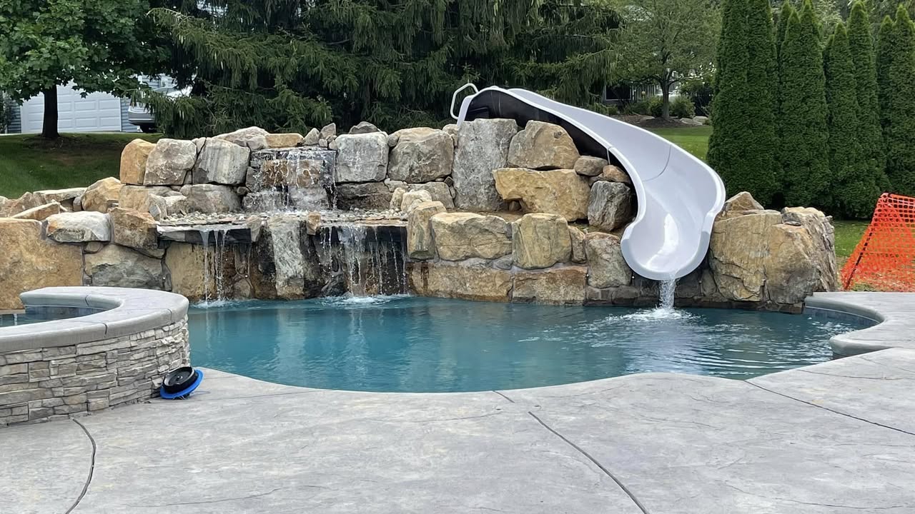 Mike Molchan's pool — rock grotto with slide