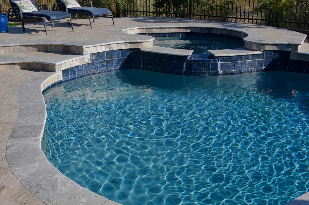 How Can I Ensure My Pool Design Complements My Outdoor Living Space?